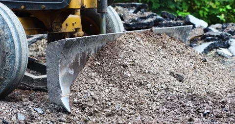 Bulldozer, Loader pushing soil and gravel at a construction site, heavy Stock Footage 333996038