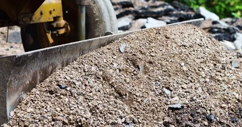 Bulldozer, Loader pushing soil and gravel at a construction site Stock Footage 333996057
