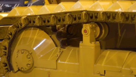 Bulldozer machine is leveling construction site. Earthmover with caterpillar clo Stock Footage 98682732