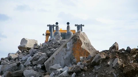 Bulldozer move the stones on camera Stock Footage 122074333