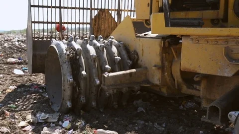Bulldozer to move the waste that is not biodegradable Stock Footage 76200760