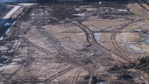 Bulldozer moving earth at a construction site from aerial perspective Stock Footage 341266946