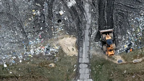 Bulldozer on the open solid waste dump, Pollution from waste Stock Footage 105402051