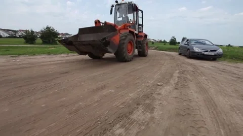 Bulldozer pass through camera on sandy road. Crane shoot Vídeo Stock 47046831