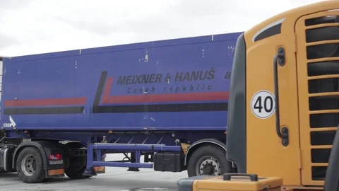 Bulldozer pours load into a trailer Stock Footage 72857203