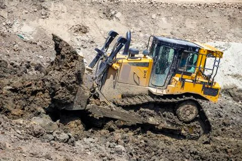 Bulldozer push large quantities of soil Stock Photos