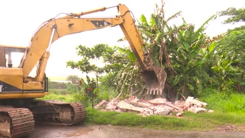 Bulldozer Pushing Debris at Construction Site Stockbeeldmateriaal 319299904