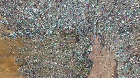 Bulldozer pushing trash Stock Footage 150983970