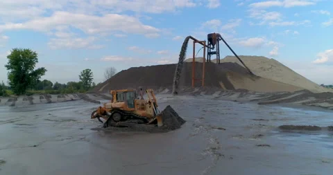 Bulldozer in Quarry. Open Mining. Leaching Of Rock. Mountains of Sand and Soil Video stock 164644325