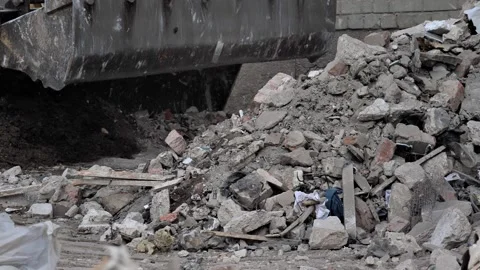 Bulldozer rakes building materials in the process of building or repairing  Stock Footage 217373790