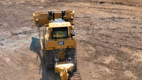 Bulldozer rides on the ground 3 Stock Footage 107378440