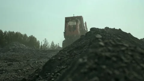 The bulldozer rides on the quarry Stock Footage 163715045