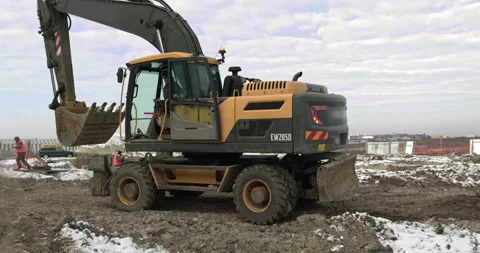 Bulldozer Rides on Sandy Road. Construction Machinery At Work On Building A Stock Footage 145330754