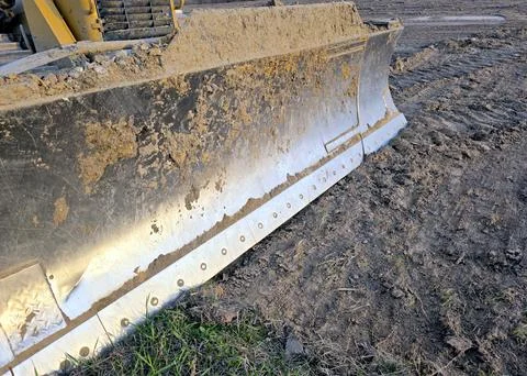 Bulldozer Scraper Moving Dirt on a Construction Site During Daylight Hours Stock Photos