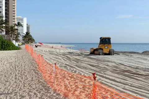 Bulldozer Spreading New Beach Sand Stock Photos