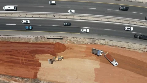 Bulldozer work on new road construction, near exists highway, Aerial view Video stock 139155535