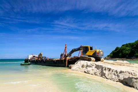 Bulldozer working on a beach Stock Photos