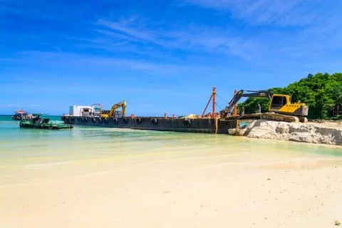 Bulldozer working on a beach Stock Photos