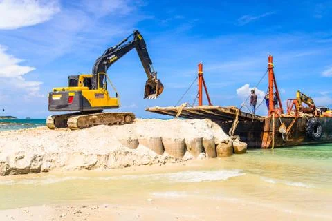 Bulldozer working on a beach Stock Photos