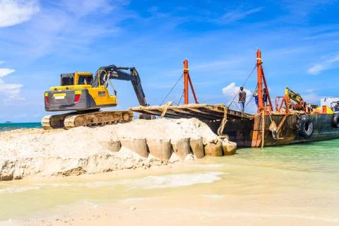 Bulldozer working on a beach Stock Photos