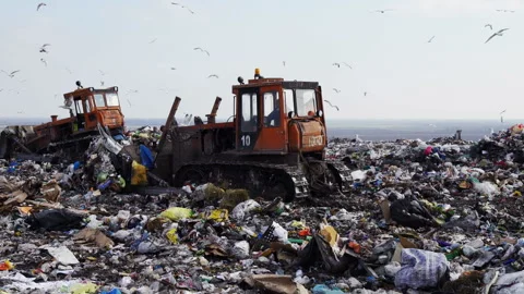 A bulldozer working on the city dump Stock Footage 87422994