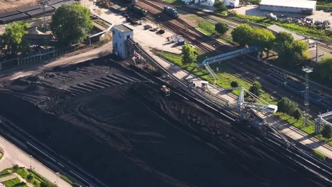 Bulldozer working at a coal fired power plant aerial view Stock Footage 344879599
