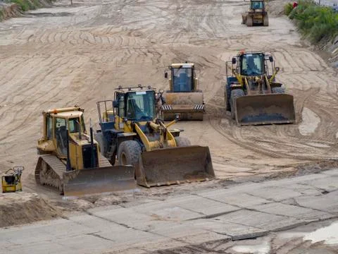 Bulldozers after working day Stock Photos
