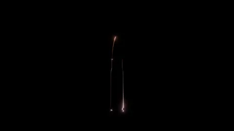 Bullet on a black background caustic glitters. Seamless loop product Stock Footage 234739249