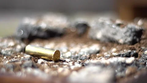 Bullet Casing Falling on to Concrete (slowed) Stock Footage 196597025