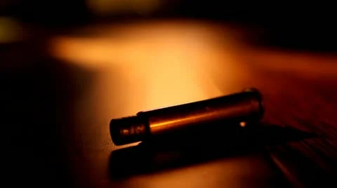 Bullet Casing on Table HD Video Stock Footage 22149660