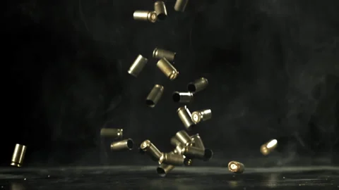 Bullet casings are pressed on the table. Filmed on a high-speed camera at 1000 Stock Footage 319325475