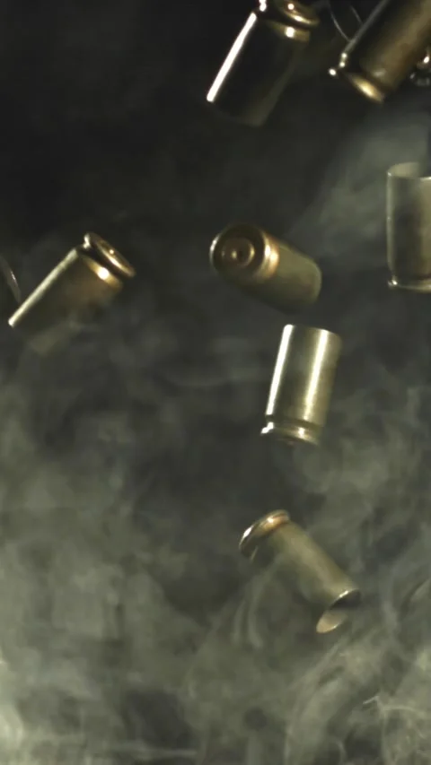 Bullet casings fly up and fall. Filmed on a high-speed camera at 1000 fps Stock Footage 335369508