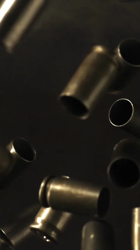 Bullet casings fly up and fall. Filmed on a high-speed camera at 1000 fps Stock Footage 335374512