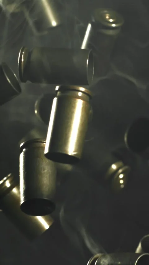 Bullet casings fly up and fall. Filmed on a high-speed camera at 1000 fps Stock Footage 335377931