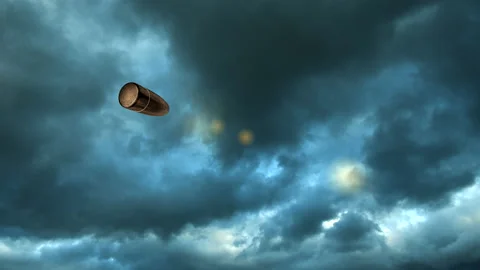 Bullet flying on background of dark storm clouds. Slow motion Stock Footage 139250977