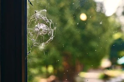 Bullet hole in the window Stock Photos