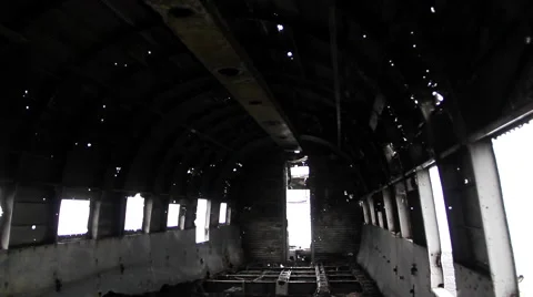 Bullet holes fuselage inside crashed airplane, dolly front camera 스톡 동영상 57513409