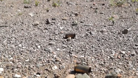 Bullet Shell Falls to the Ground .Mid shot 스톡 동영상 89780982