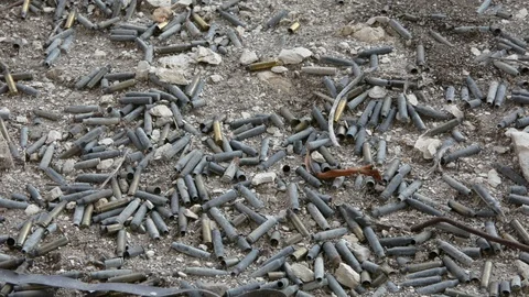  bullet shells drop on the ground Stock Footage 98782114