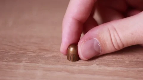Bullet on the table closeup Stock Footage 83747961