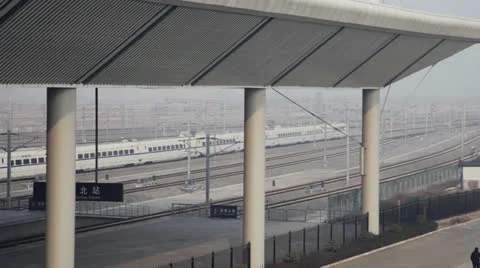 Bullet train passeing a station Stock Footage 24773259