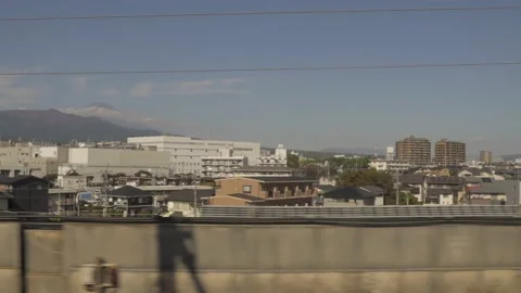 Bullet train passes by mount fuji background Stock Footage 230536183