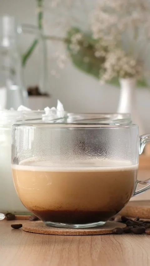 Bulletproof coffee is a coffee drink with added fats, ghee, clarified butter, co Stock Footage 315103729