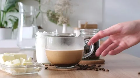 Bulletproof coffee preparation sequence showcasing rich textures, creamy layers, Stock Footage 315103329