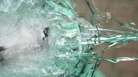 Bulletproof glass after the test, cracks and dents on the window from the bullet Stock Footage 108807053