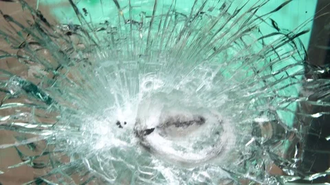 Bulletproof glass after the test, cracks and dents on the window from the bullet Stock Footage 108867040