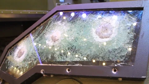Bulletproof Glass is Fired From a Firearm Tests on the Armor and Strength of Stock Footage 81202222