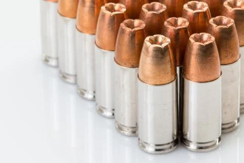 Bullets for a 9mm on a white background. Stock Photos