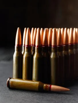 Bullets, ammunition on a dark background, close-up Stock Photos