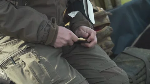 Bullets are shoved into the clip close-up Stock Footage 243486295